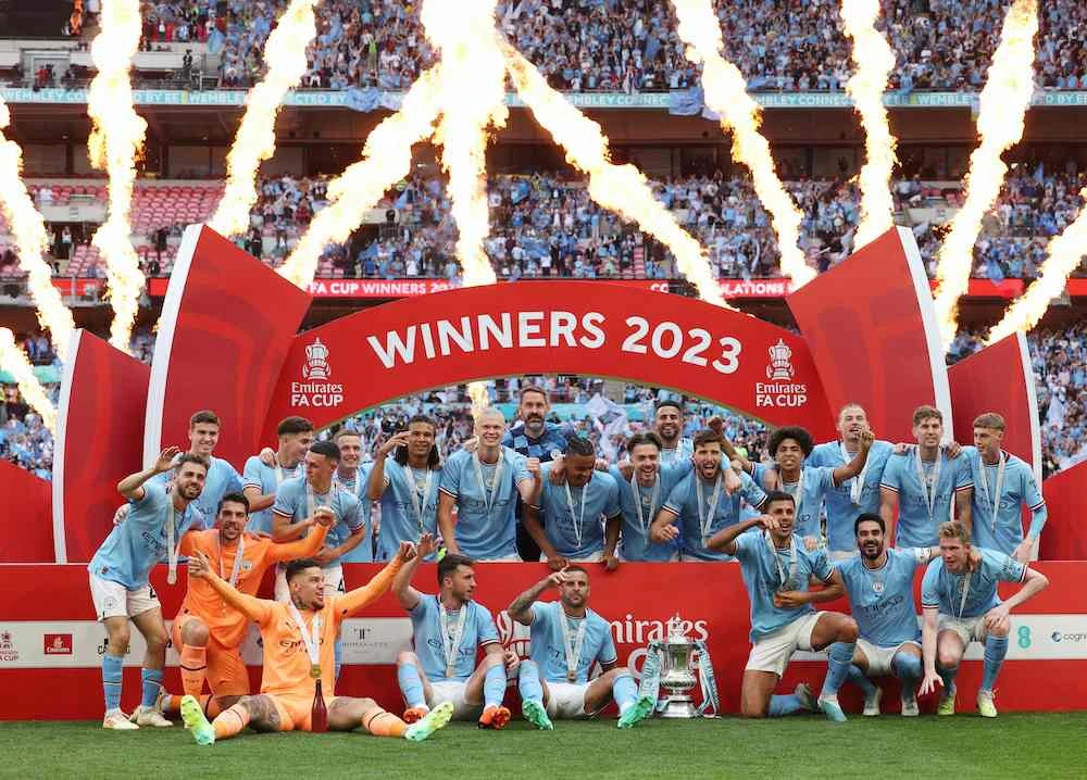 Manchester City players celebrate winning the English FA Cup final football match between Manchester City and Manchester United at Wembley stadium, in London, on June 3, 2023. ( (Photo by Adrian Dennis/AFP)