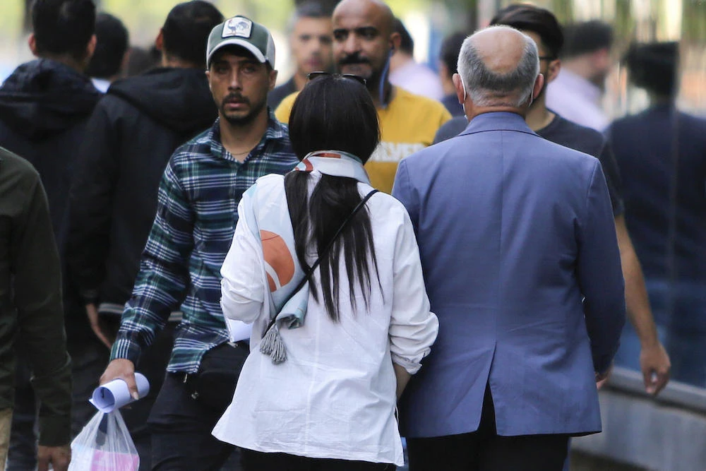 An Iranian draft law proposes increased fines for ‘any person removing their veil in public places or on the Internet’ but withdraws the threat of a prison sentence. (AFP)