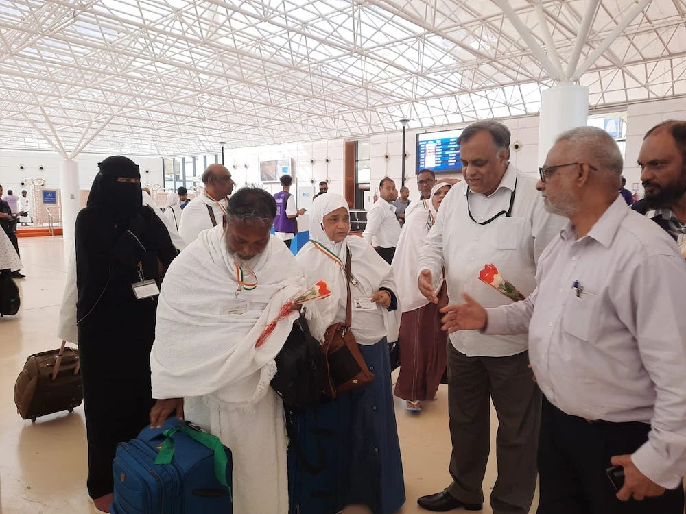 Indian ambassador Suhel Ajaz Khan welcomes Hajj pilgrims arriving in Jeddah airport on June 7, 2023. (Indian Embassy in Riyadh)