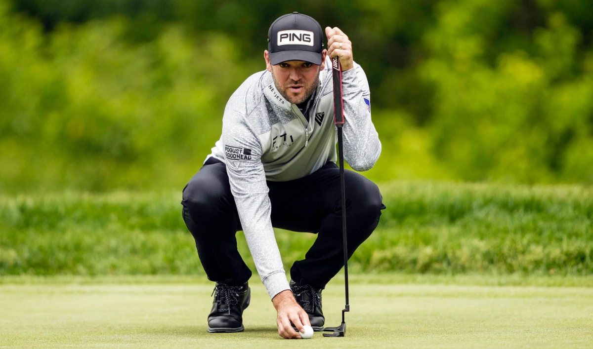 Canadian Corey Conners lines up his putt on the ninth hole during the first round of the Canadian Open in Toronto on Thursday. (AP)