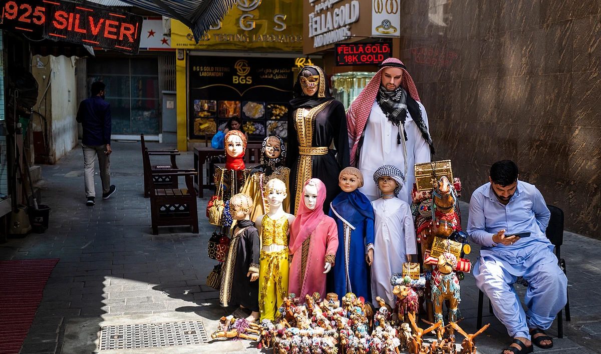 A vendor waits for customers at his store in a market area in Dubai on May 18, 2023. (Photo courtesy: AFP)