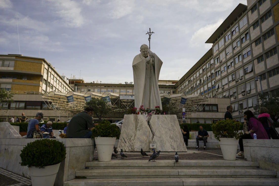 Above, a statue of Saint John Paul II towers at the entrance of the Agostino Gemelli University Polyclinic in Rome, where Pope Francis is recovering after undergoing abdominal surgery on Wednesday. (AP)