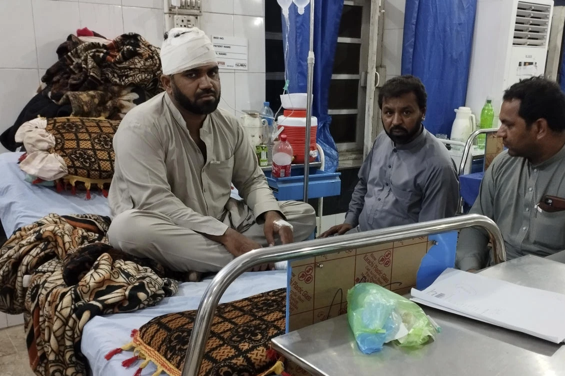An injured victim of rain storm is treated at a hospital in Bannu, a town of Pakistan's Khyber Pakhtunkhwa province, Saturday, June 10, 2023. (AP)