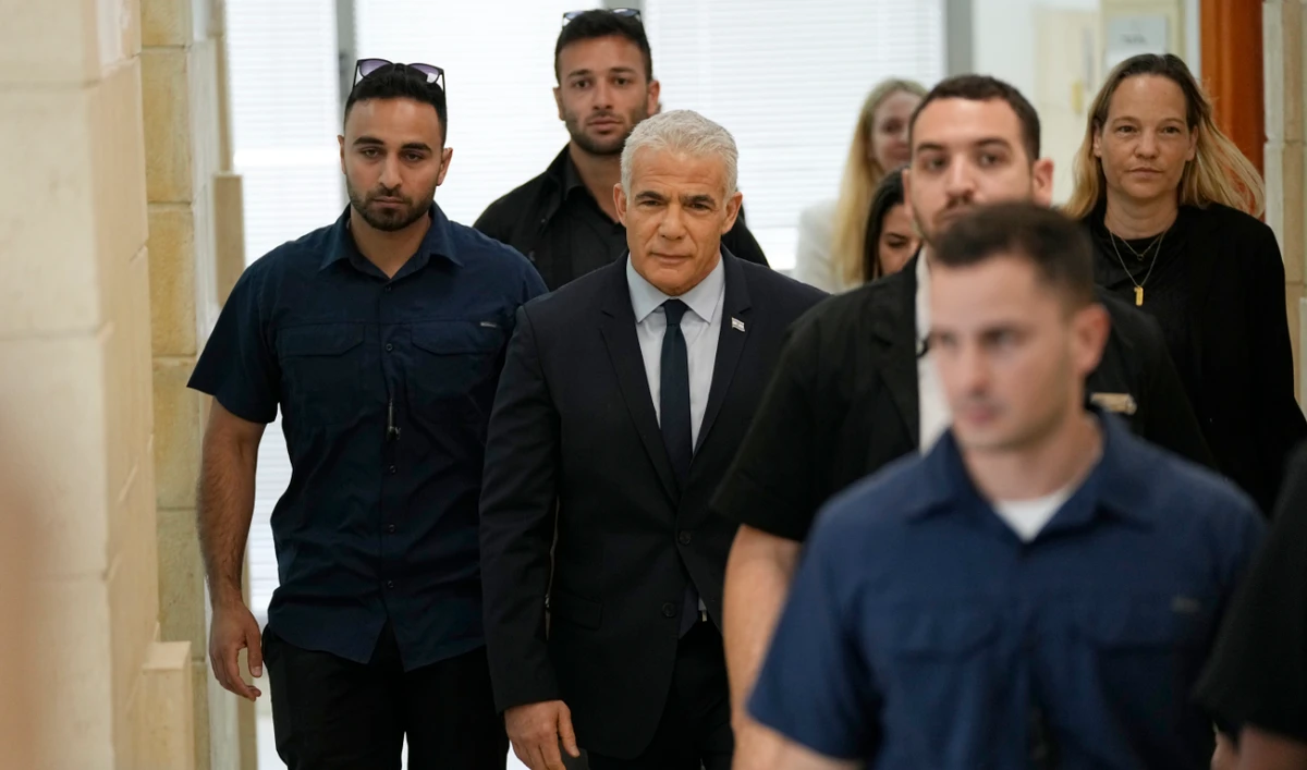 Israeli opposition leader Yair Lapid arrives to testify at the trial of Prime Minister Benjamin Netanyahu on corruption charges at the Jerusalem District Court, in east Jerusalem, Monday, June 12, 2023. (AP)