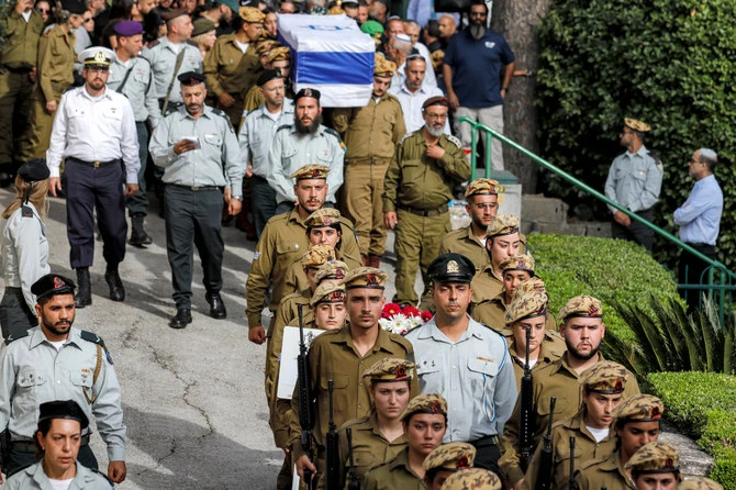 Soldiers march ahead of the coffin of Staff Sergeant Ori Izhak Iluz, one of three Israeli soldiers killed in the cross-border incident with Egypt, during the funeral in Israel. (AFP/File)