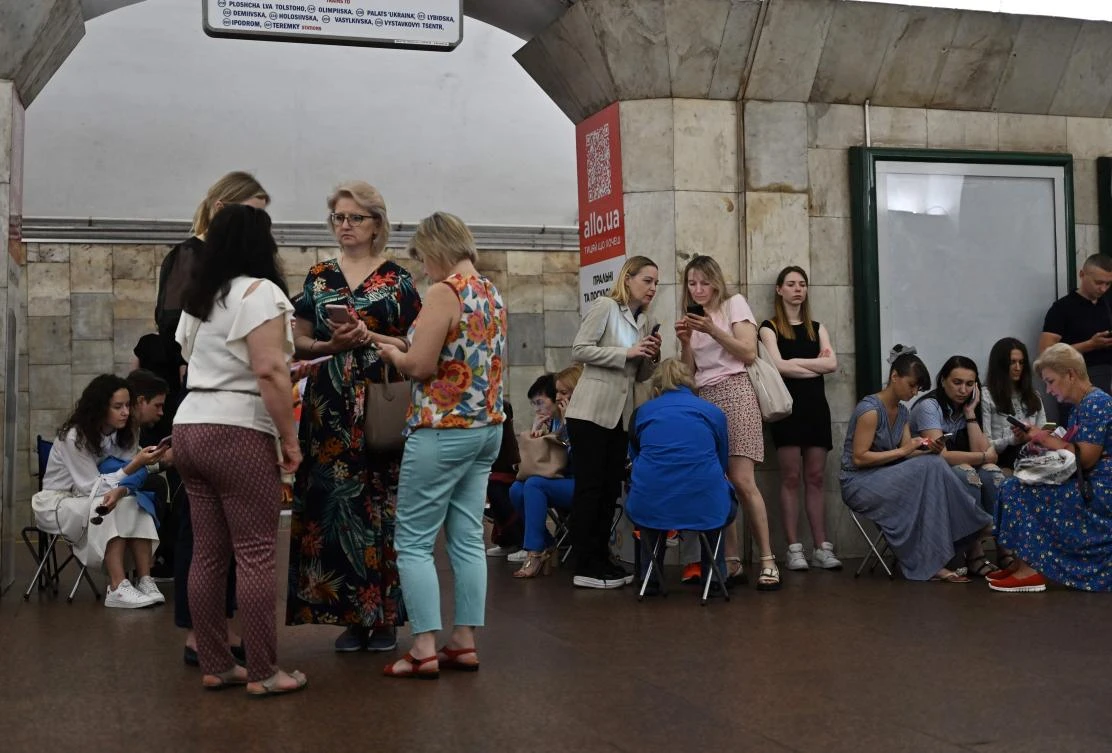 Local residents take shelter in a metro station in the center of Kyiv during a Russian missile attack on June 16, 2023, amid the Russian invasion of Ukraine. (AFP)