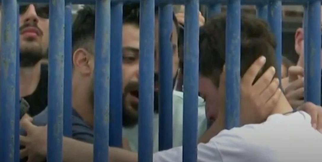 A Syrian teenager, who survived after the boat carrying him sank in the Mediterranean, has been reunited with his brother. (Screenshot/Sky News)