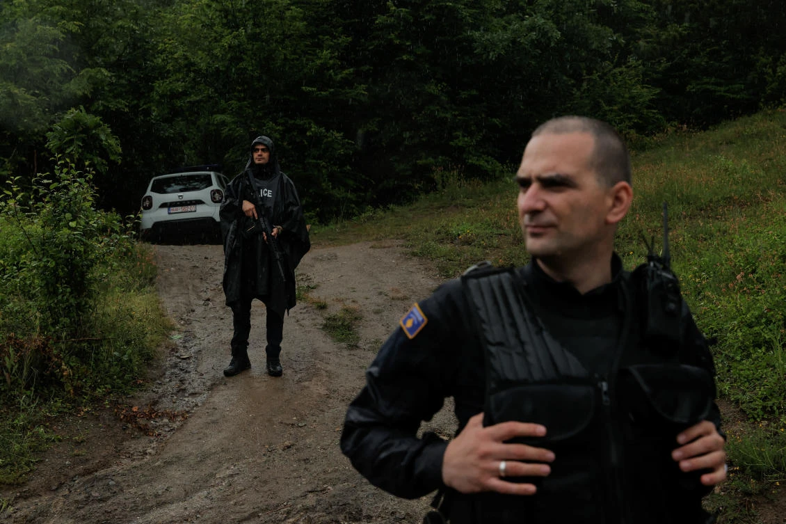 Kosovo police officers guard the site near the village of Bare, Kosovo, on June 14, 2023. (Reuters)