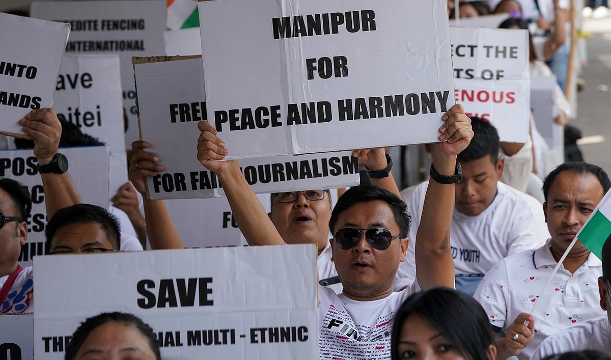 Members of the Hyderabad Manipur Society holding placards condemning violence in their home state gather in Hyderabad, India, Sunday, June 18, 2023. (AP)