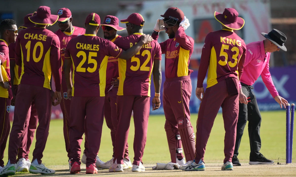 West Indies players are seen on the pitch during their ICC Men’s Cricket World Cup Qualifier match against the United States at Takashinga Sports Club in Harare, Zimbabwe, Sunday, June 18, 2023. (AP)