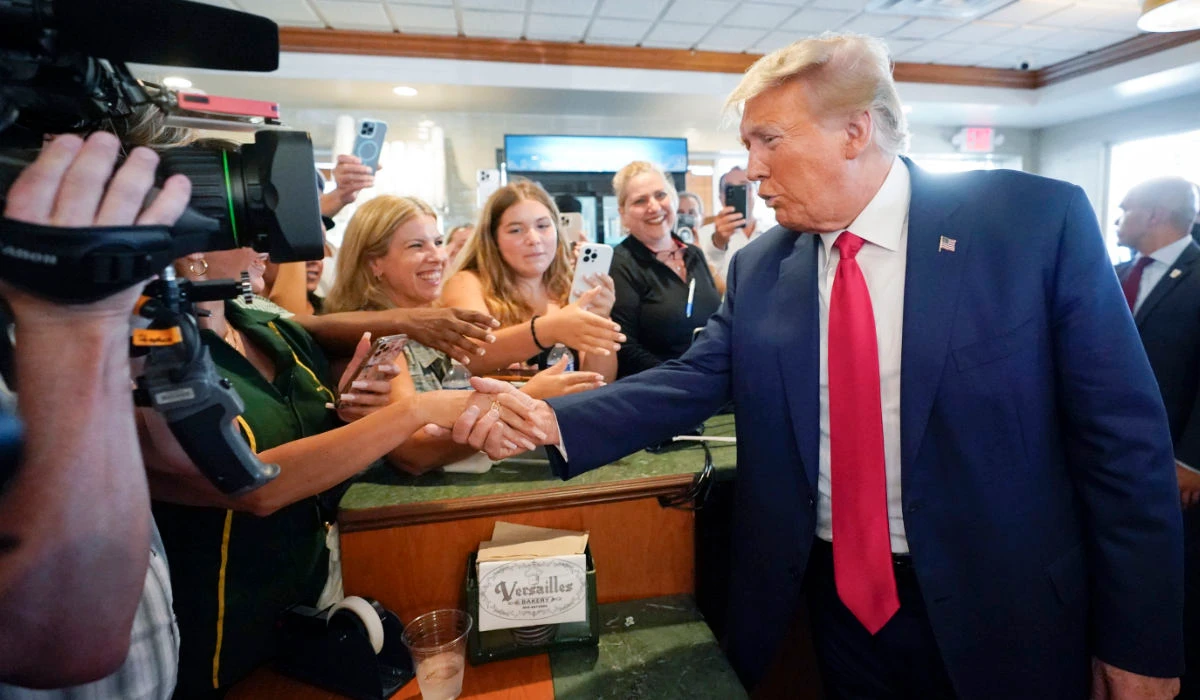 Former President Donald Trump greets supporters at Versailles restaurant on Tuesday, June 13, 2023, in Miami. (AP)