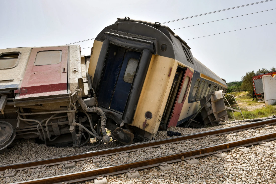 Derailed passenger cars are pictured at the scene of a train accident near Msaken, about 150 kilometres south of the capital in eastern Tunisia. (AFP)