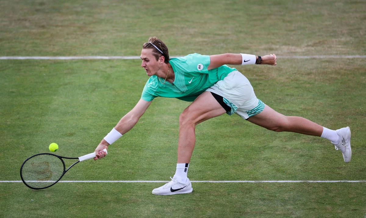 US player Sebastian Korda returns to compatriot Frances Tiafoe during their round of 16 men's singles match on Day 5 of the Cinch ATP tennis Championships at Queen's Club in west London Wednesday. (AFP)