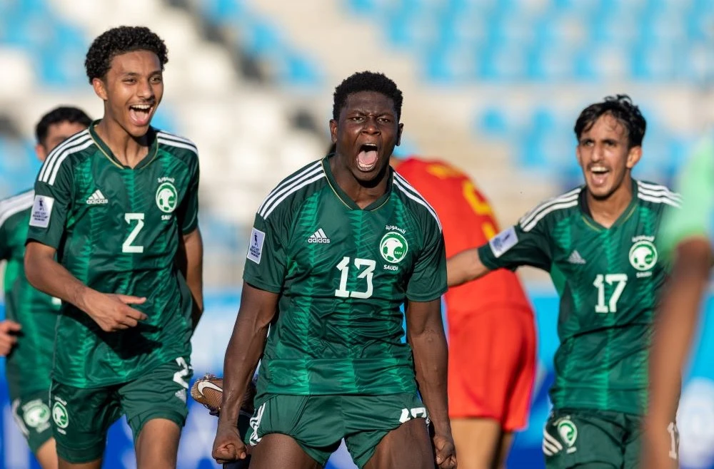 Mohammed Al-Muwallad celebrates scoring against China. (Twitter/@SaudiNT)