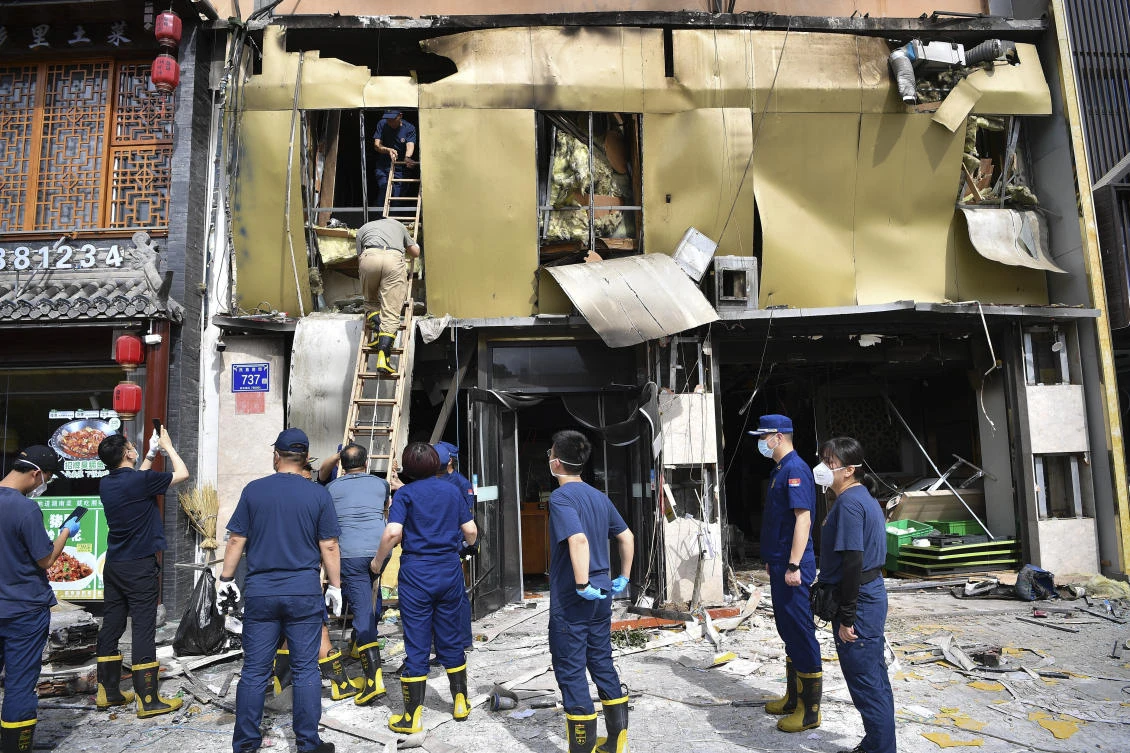 Members of China’s Ministry of Emergency Management conduct an inspection at the site of an explosion at a restaurant in Yinchuan, northwest China’s Ningxia Hui Autonomous Region on June 22, 2023. (Xinhua via AP)