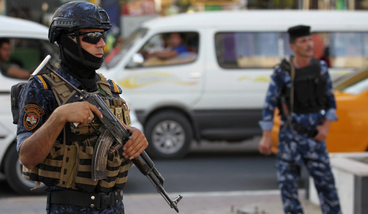 Members of the Iraqi Federal Police patrol the streets of Baghdad's Shula district. (AFP file photo)