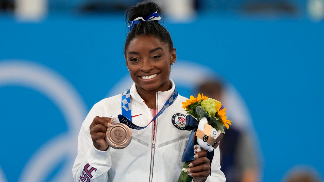 US gymnast Simone Biles with her bronze medal for the artistic gymnastics women's balance beam apparatus at the 2020 Summer Olympics. USA Gymnastics announced Wednesday that Bileswill be part of the field at the US Classic outside of Chicago on Aug. 5. (File/AP)