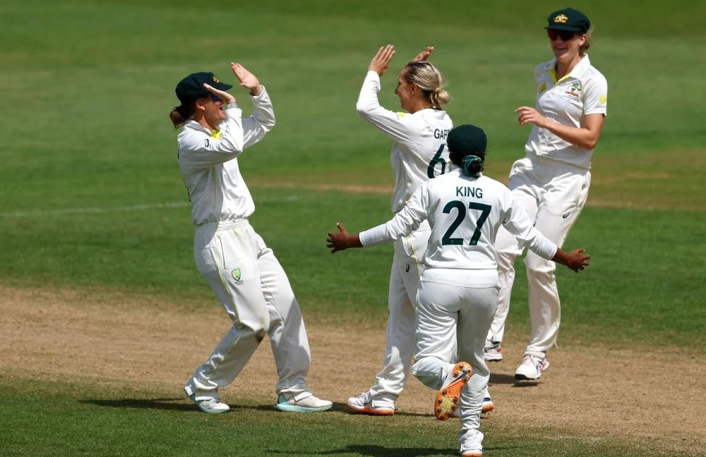 Australia’s Ashleigh Gardner celebrates with teammates after taking the wicket of England’s Danni Wyatt at Trent Bridge, Nottingham, Britain, June 26, 2023. (Reuters)