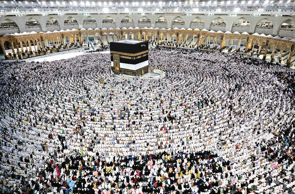 Pilgrims from around the world gather around the Kaaba at the Grand Mosque in Makkah on the second day of Eid Al-Adha. The Saudi porticos surrounding and complementing the Ottoman porticos can be seen in the picture at the back. (AFP)