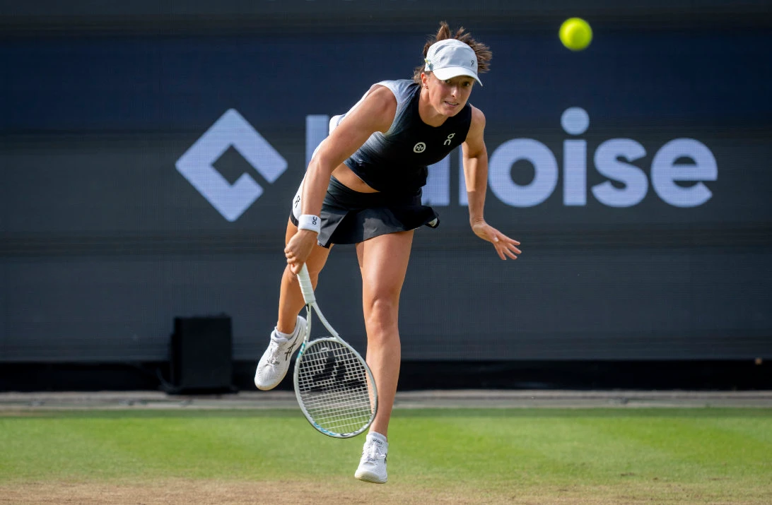 Poland's Iga Swiatek serves against Russia's Anna Blinkova in the quarterfinal at the WTA tennis tournament in Bad Homburg, Germany Thursday. (AP)