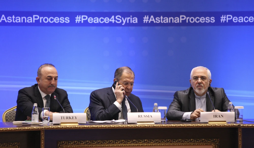 Foreign ministers, Sergei Lavrov (C) of Russia, Mevlut Cavusoglu (L) of Turkey and Mohammad Javad Zarif of Iran in Astana.