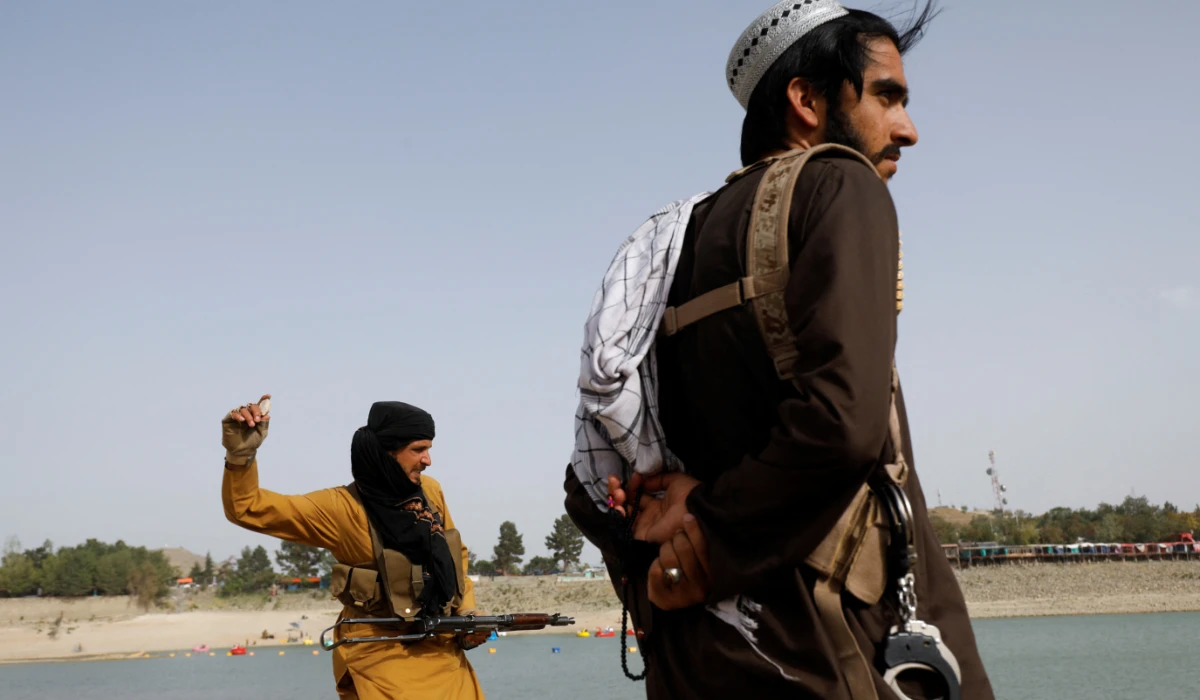 Taliban fighters stand along Qargha lake in Kabul, Afghanistan, July 29, 2022. (REUTERS)