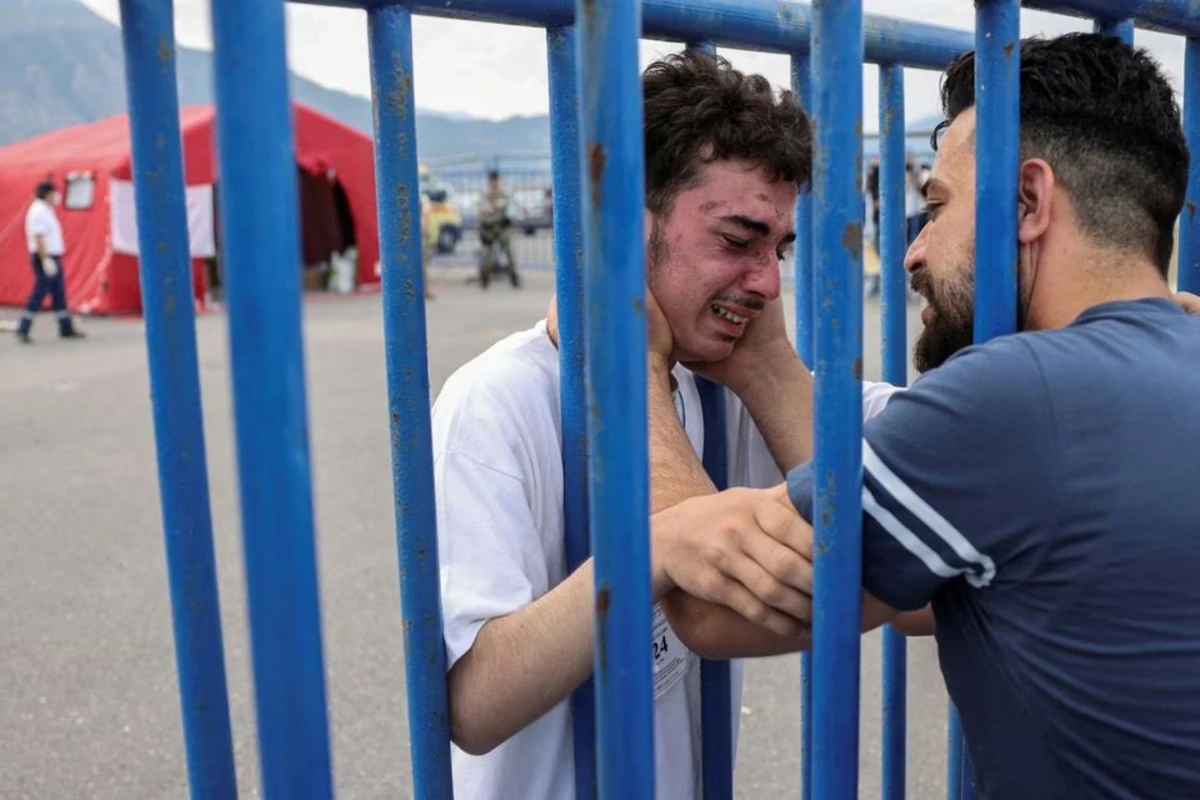Fadi, a survivor of the migrant boat tragedy in the Mediterranean, meets his brother at the port of Kalamata, Greece (Reuters)
