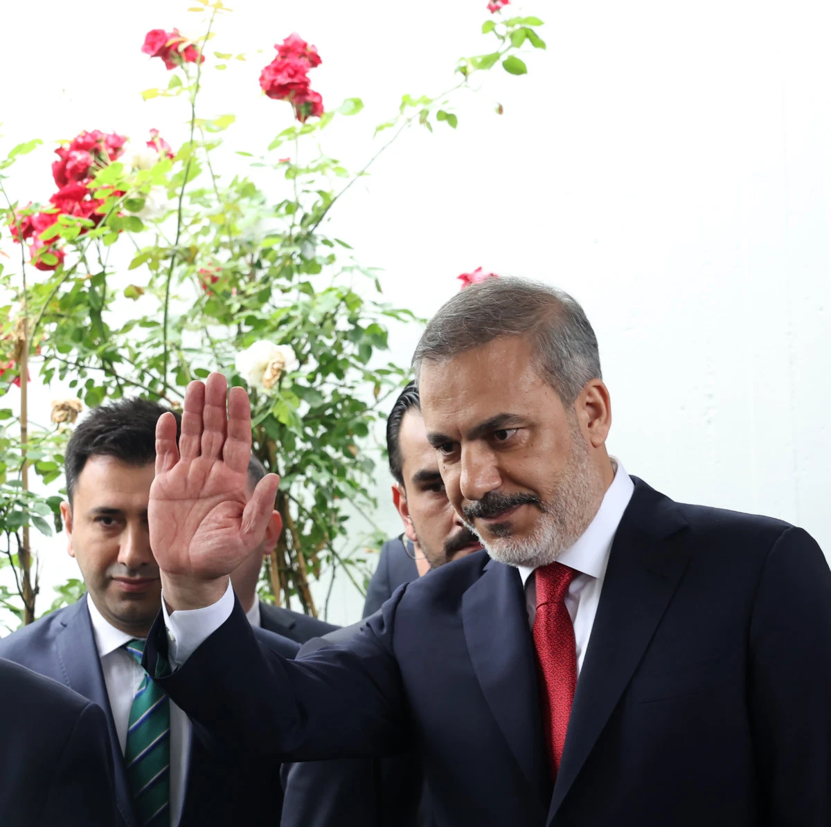 Turkey's newly appointed FM Hakan Fidan bids farewell to his predecessor, Mevlut Cavusoglu, on June 5, 2022. (AFP)