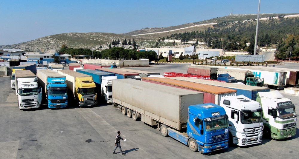 Trucks carrying aid from the UN World Food Programme (WFP) parked at Bab Al-Hawa crossing, Syria, Feb. 20, 2023. (Reuters)