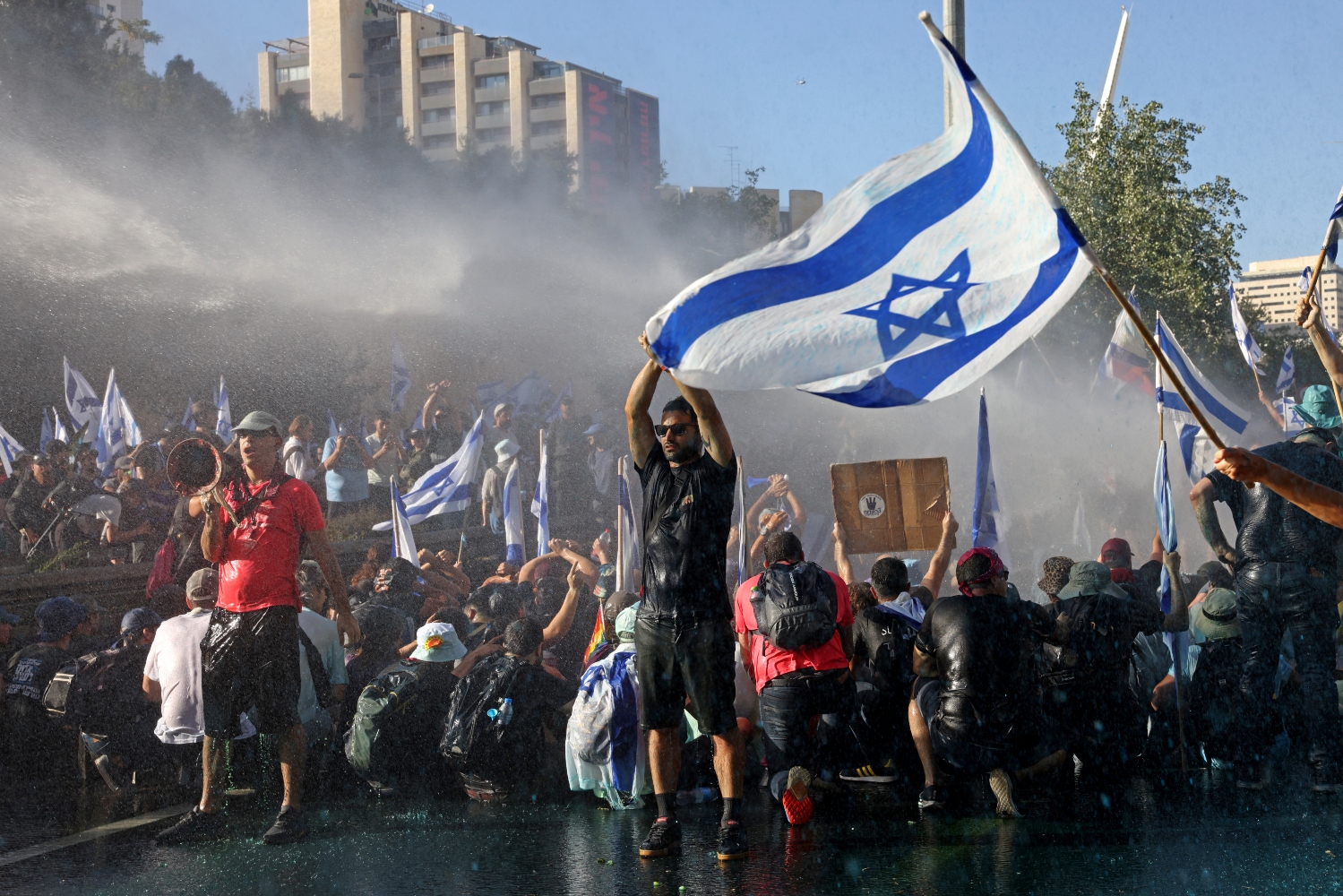 Nearly half of the Israeli population is protesting the judicial reforms championed under the leadership of Netanyahu (AFP)