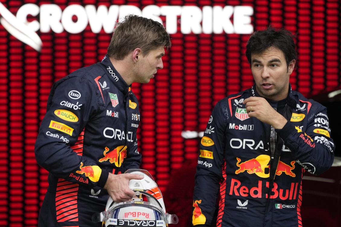 Race winner Red Bull driver Max Verstappen of the Netherlands, left, speaks with second placed Red Bull driver Sergio Perez of Mexico after the sprint race, at the Red Bull Ring racetrack, in Spielberg, Austria, Saturday, July 1, 2023. The Formula One Austrian Grand Prix will be held on Sunday, July 2, 2023. (AP)