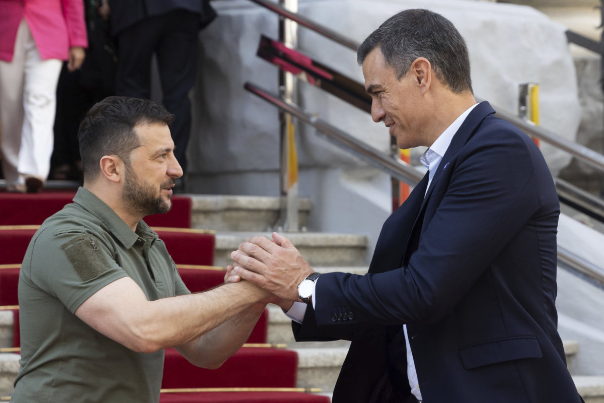 Ukrainian President Volodymyr Zelenskyy, left, welcomes visiting Prime Minister Pedro Sanchez of Spain in Kyiv on July 1, 2023. (Ukrainian Presidential Office via AP)