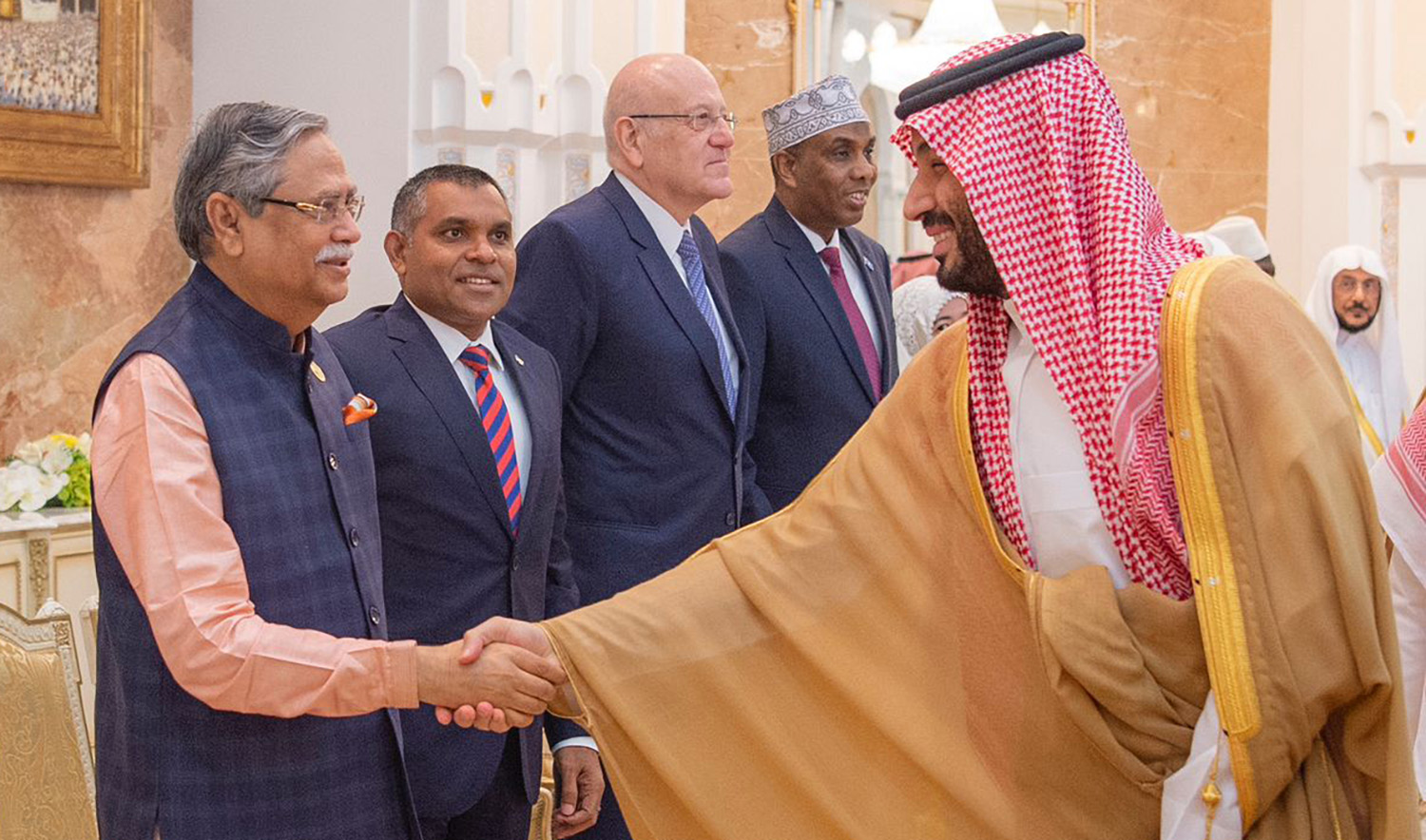 Bangladesh President Mohammed Shahabuddin, left, shakes hands with Saudi Crown Prince Mohammed bin Salman during a reception for VIP Hajj participants on June 29, 2023. (SPA)