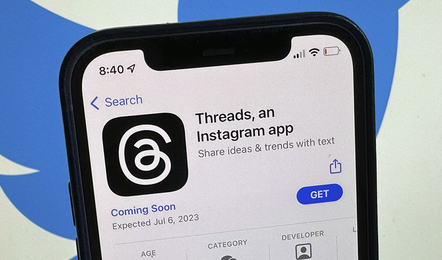 The announcement of the social media app 'Threads' is displayed in Apple's US App Store seen on the screen of a smartphone in Berlin, Germany, on July 4, 2023. (DPA via AP)