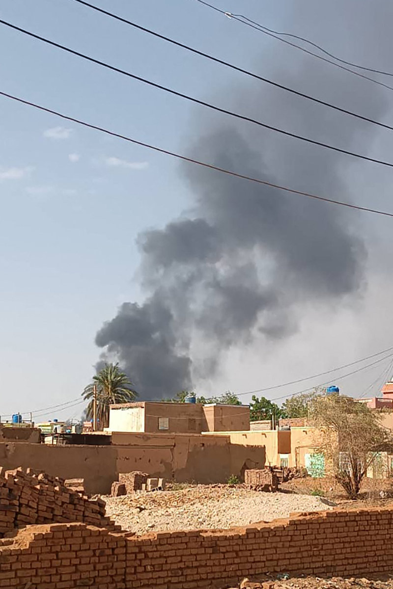 Smoke billows in Omdurman, Sudan's capital's twin city, on July 3, 2023, amid fighting between army and RSF paramilitaries. (AFP)