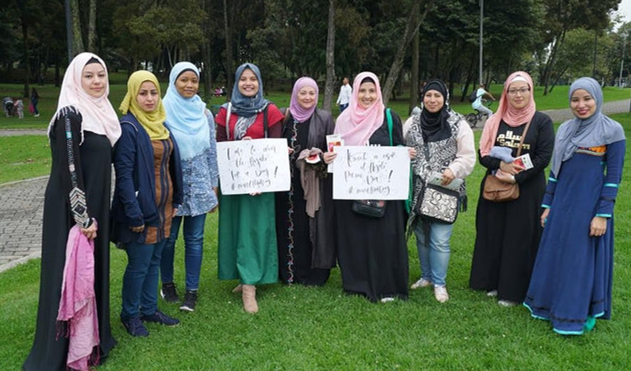 The undated photo shows Muslim women holding banners to raise awareness about Islam in Colombia, South America.