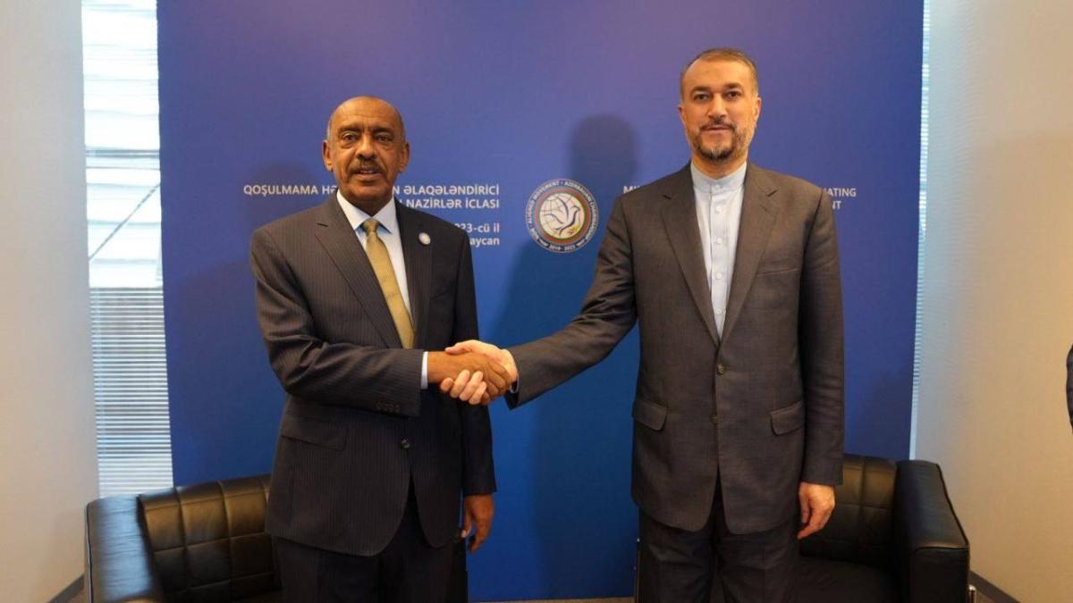 Iranian Foreign Minister Hossein Amirabdollahian shakes hands with Sudan’s acting Foreign Minister, Ali Sadeq, in Baku on Thursday. (@IRIMFA_EN)
