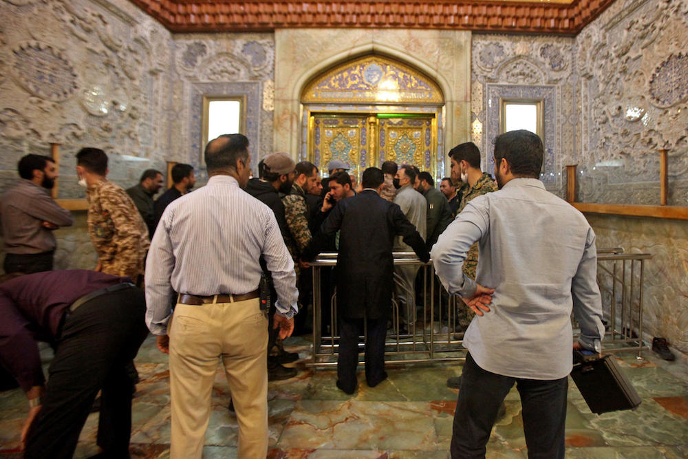 Above, Iranian security forces deploy following an armed attack at the Shah Cheragh shrine in Shiraz on Oct. 26, 2022. (ISNA/AFP)