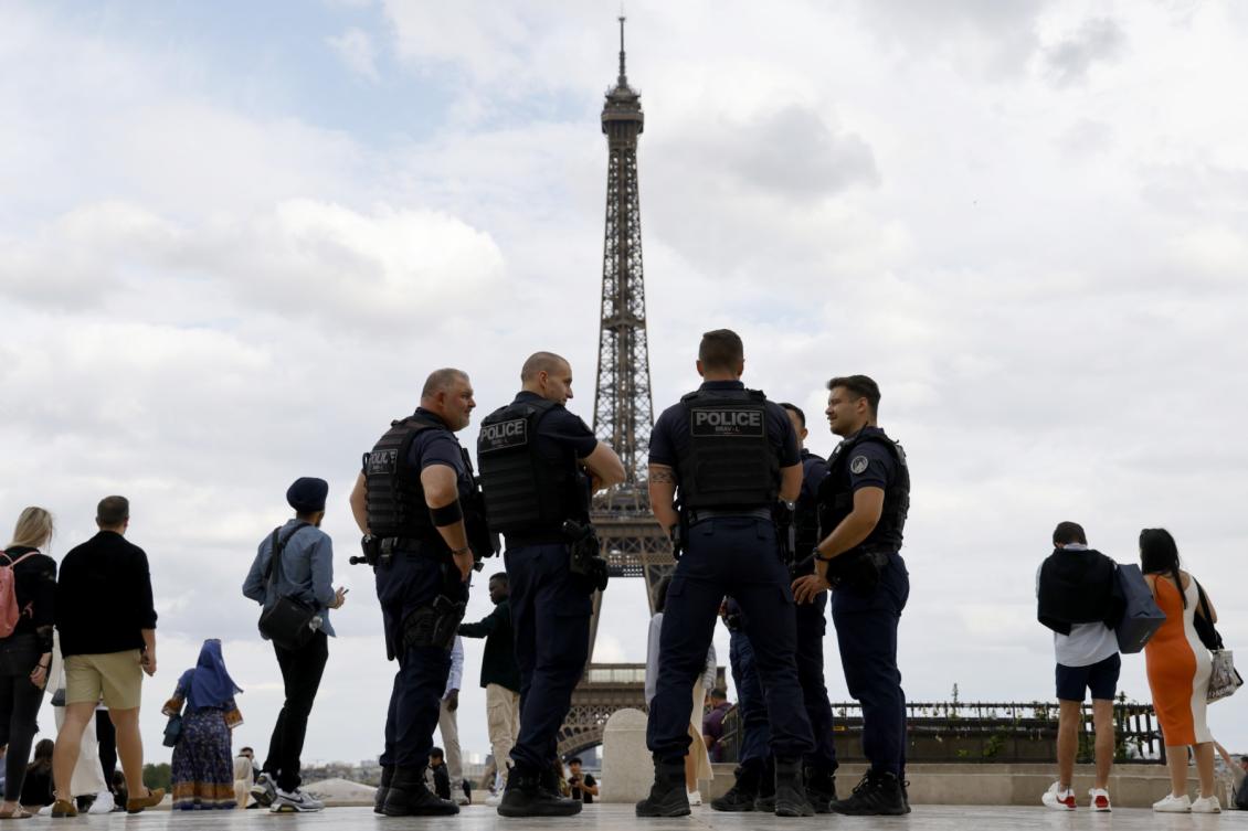 French police officers of the Repression of Violent Action Brigade (Brav or Brigade de repression de l'action violente) stand on the Trocadero Plaza, with the Eiffel Tower in background in Paris, on July 5, 2023. (AFP)