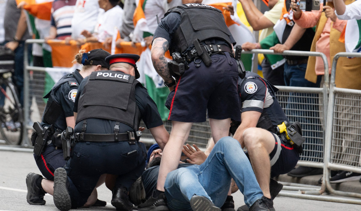 Police arrest a Sikh protestor during a demonstration for the independence of Khalistan in front of the Indian Consulate in Toronto, Canada, on July 8, 2023. (AFP)