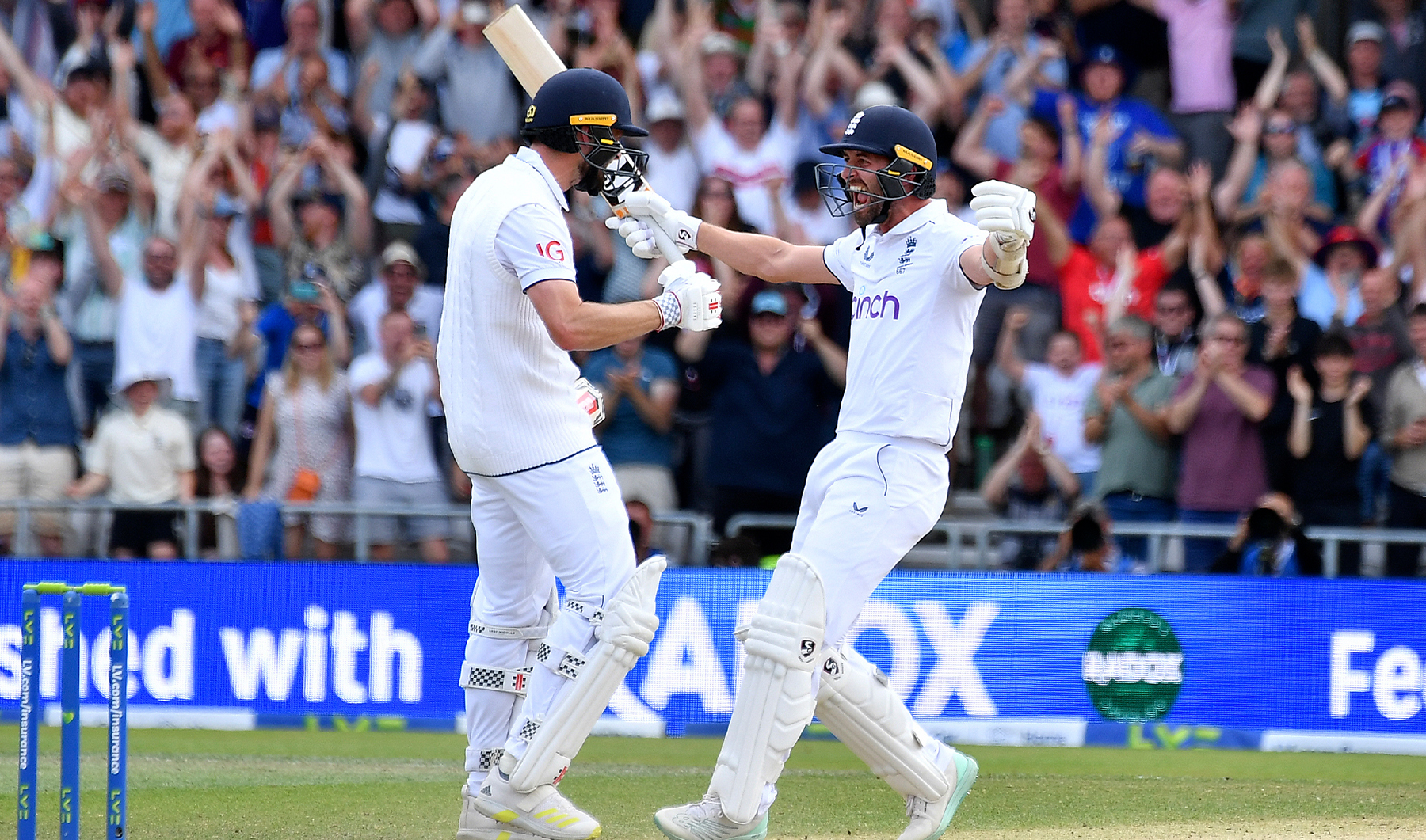 England's Mark Wood, right, and England's Chris Woakes celebrate after winning the fourth day of the third Ashes Test match between England and Australia at Headingley, Leeds, England, on July 9, 2023. (AP)