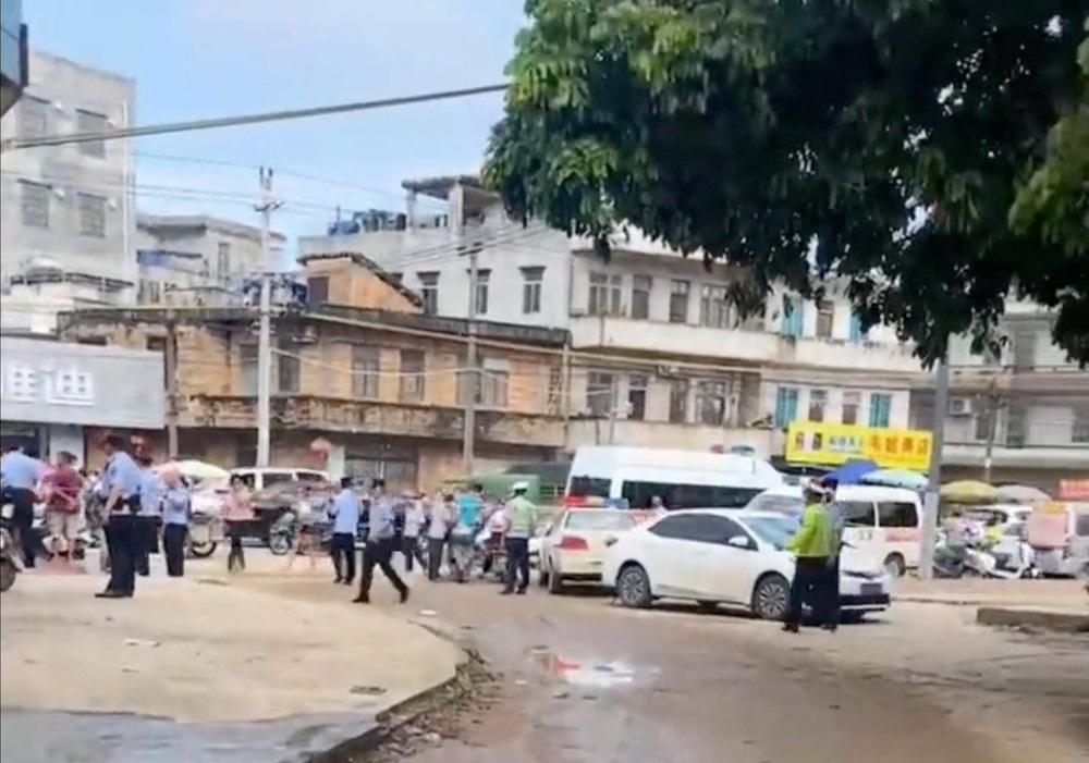 A police cordon is placed in the aftermath of a stabbing attack at a kindergarten in Lianjiang of Guangdong province, China in this still image obtained a social media video. (Reuters)