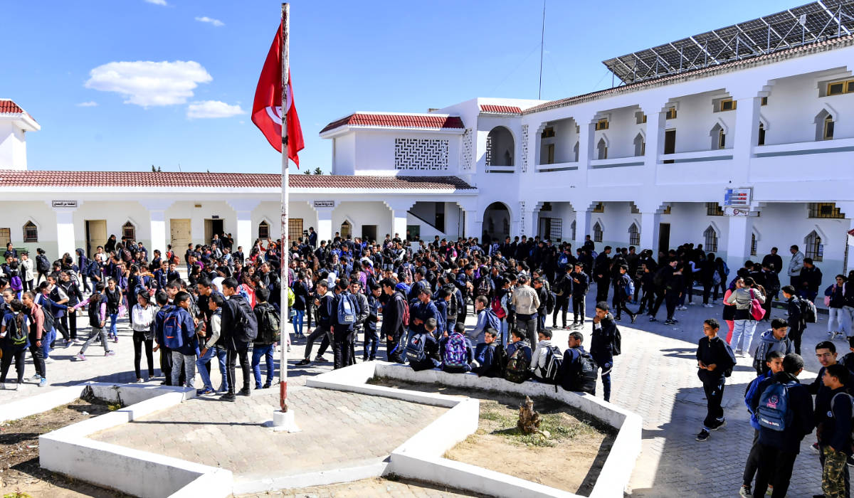 Pupils gather in the playground of the Makhtar boarding school before returning to class on September 29, 2022, in the Tunisian central-west region of the same name. (AFP)