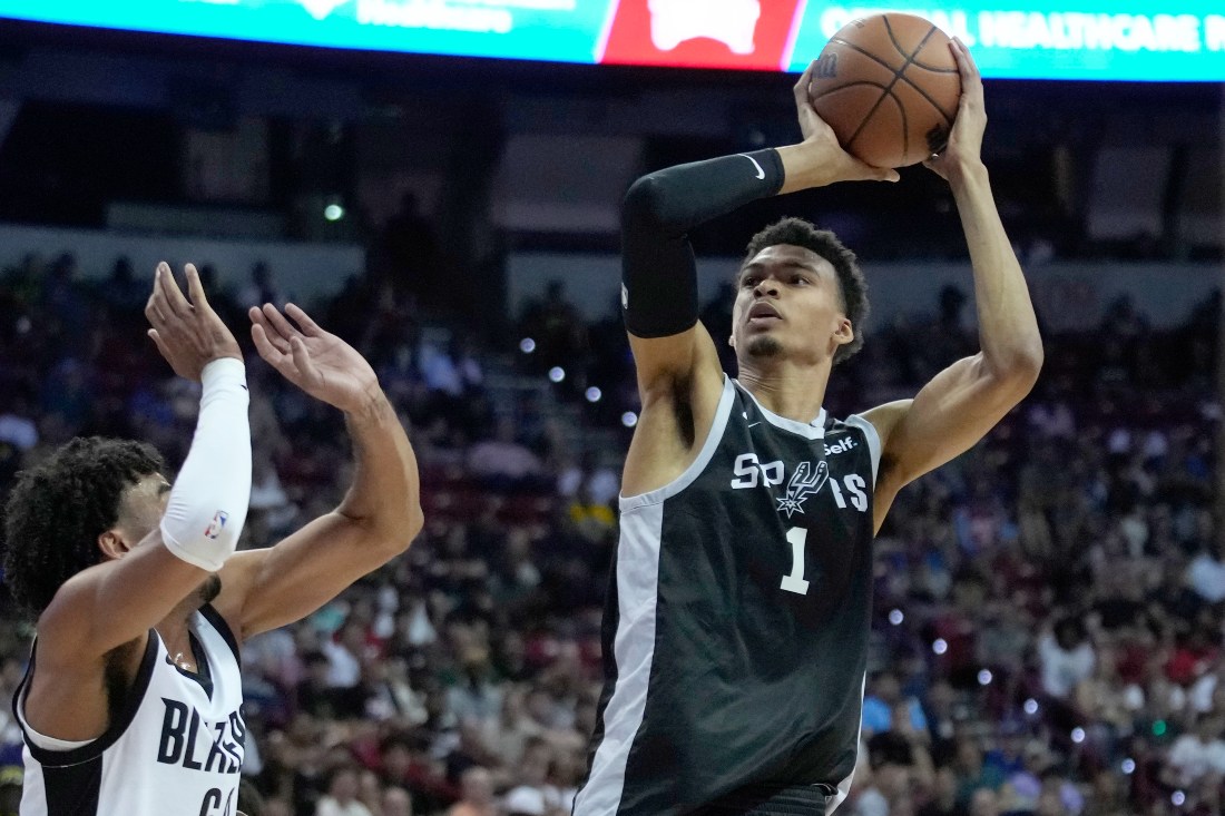 San Antonio Spurs' Victor Wembanyama shoots over Portland Trail Blazers' Justin Minaya during the second half of an NBA summer league basketball game Sunday in Las Vegas. (AP)