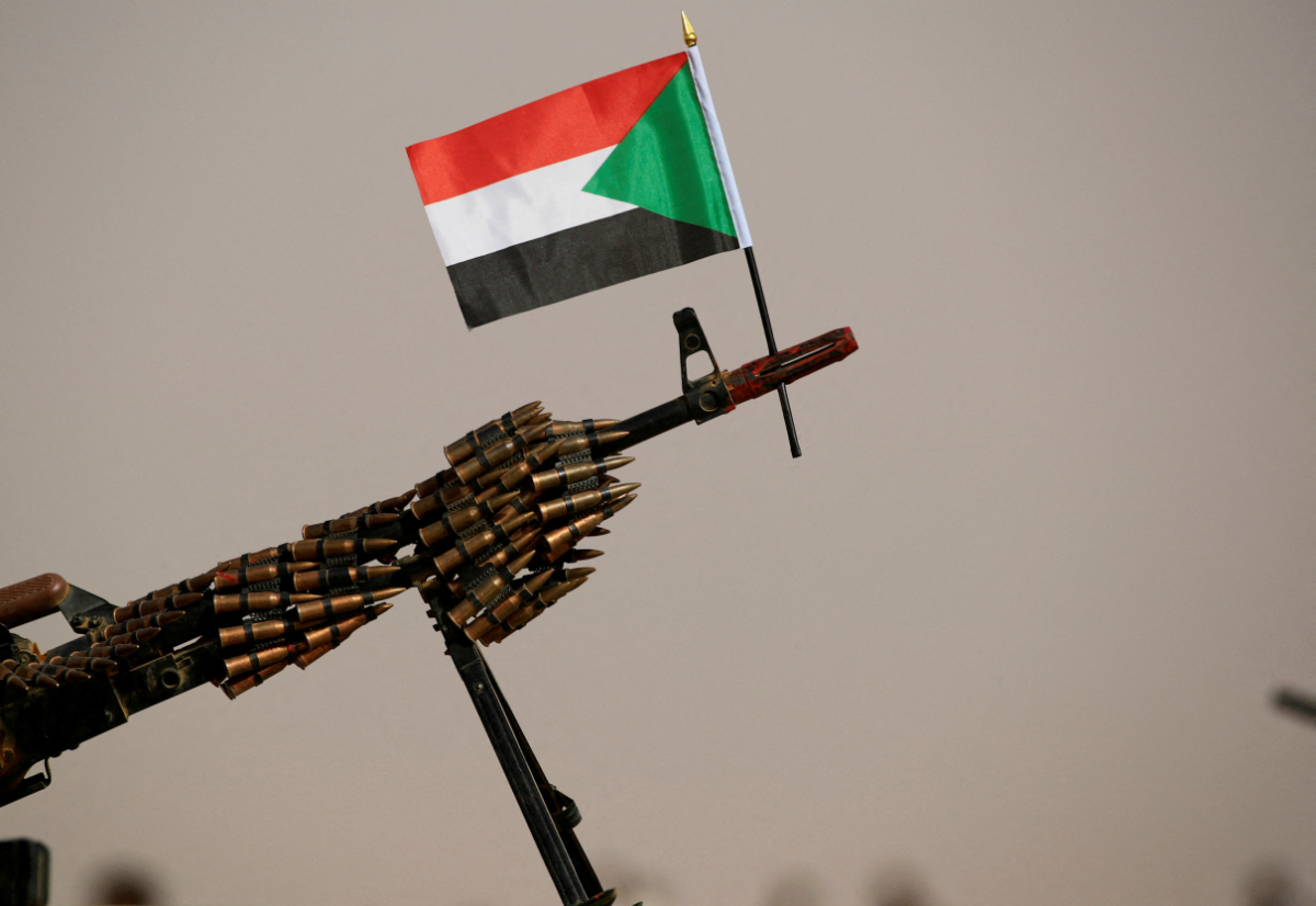 A Sudanese national flag is attached to a machine gun of Paramilitary Rapid Support Forces (RSF) soldiers as they wait for the arrival of Lieutenant General Mohamed Hamdan Dagalo, deputy head of the military council and head of RSF, before a meeting in Aprag village 60, kilometers away from Khartoum, Sudan, June 22, 2019. (REUTERS)
