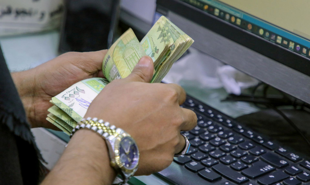 The riyal sank to 1,500 per dollar in Aden and other cities, plummeting from the May figure of 1,300 and ending months of stability. (Reuters/File)