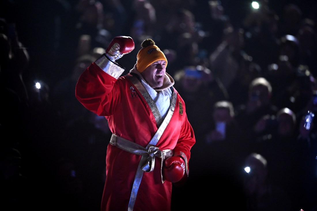 Undefeated heavyweight champion set to take on MMA star on Oct. 28 in Saudi Arabia. (FILE/AFP)