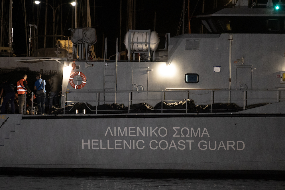 Above, bags with bodies at a Greek coast guard vessel docked at the port in Kalamata, Greece on June 14, 2023. (AFP)