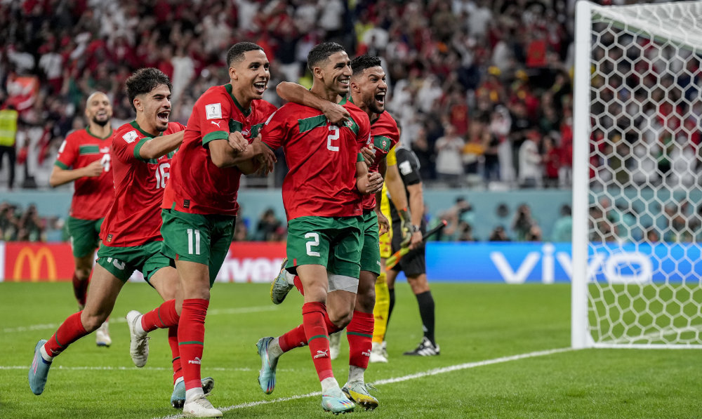 Morocco's players celebrate their victory over Spain during their World Cup round of 16 on Dec. 6, 2022. Nigeria and South Africa were drawn in the same World Cup qualifying group on Thursday July 13, 2023 in a re-shaped African competition. (File/AP)