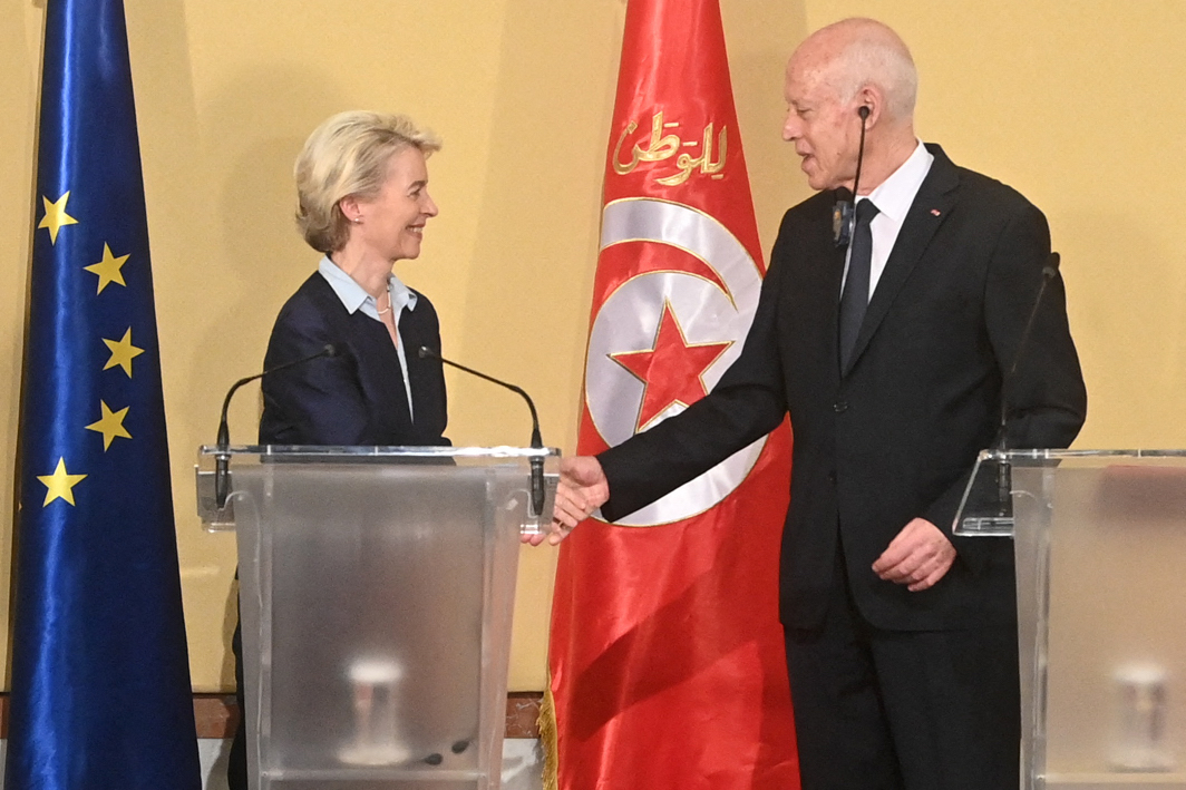 European Commission President Ursula Von der Leyen shakes the hand of Tunisia's President Kais Saied at the presidential palace in Tunis on July 16, 2023. (AFP)